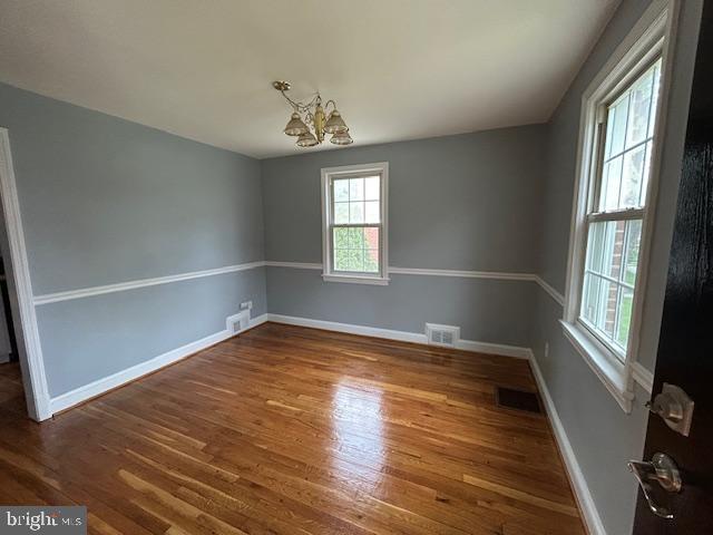 9923 Grayson Avenue Silver Spring, MD 20901 - Photo 13 of 24 wooden floor in an empty room with a window