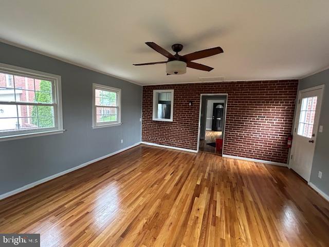 9923 Grayson Avenue Silver Spring, MD 20901 - Photo 14 of 24 a view of empty room with wooden floor and fan