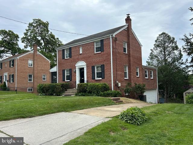 9923 Grayson Avenue Silver Spring, MD 20901 - Photo 2 of 24 a front view of a house with a yard