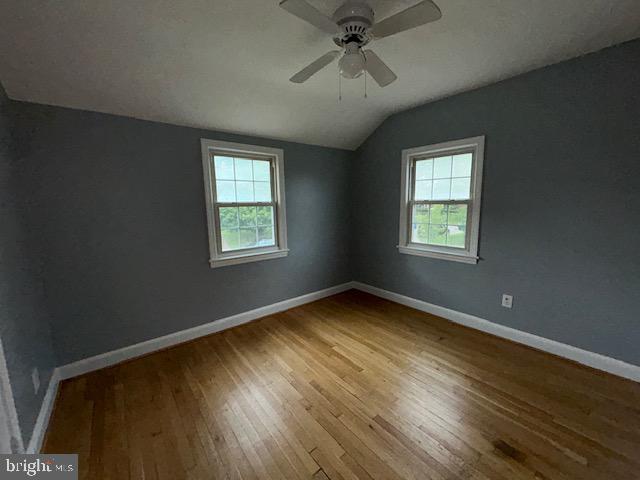 9923 Grayson Avenue Silver Spring, MD 20901 - Photo 24 of 24 a view of an empty room with a window and wooden floor