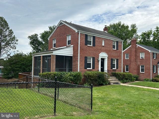 9923 Grayson Avenue Silver Spring, MD 20901 - Photo 4 of 24 a front view of a house with a yard