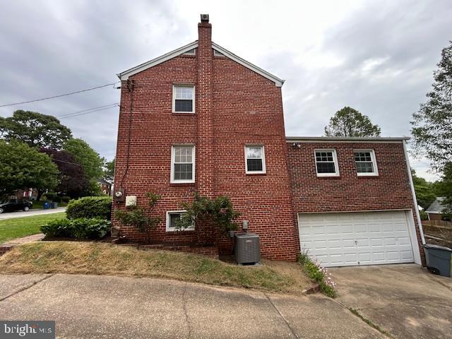 9923 Grayson Avenue Silver Spring, MD 20901 - Photo 5 of 24 a front view of a house with garden