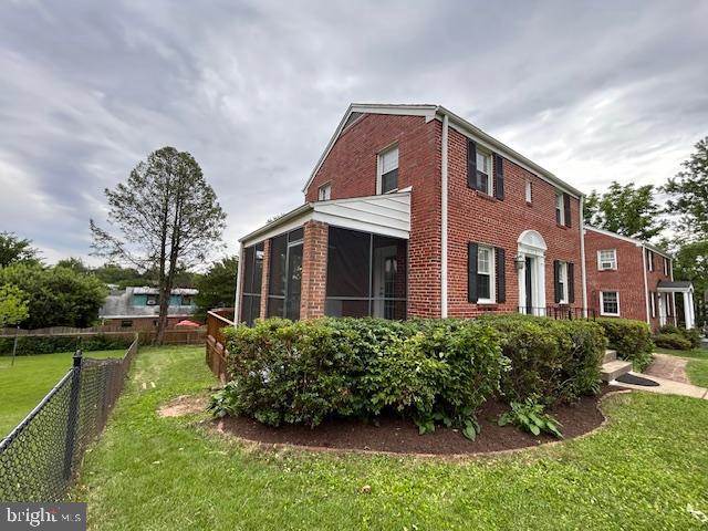 9923 Grayson Avenue Silver Spring, MD 20901 - Photo 6 of 24 a front view of a house with a yard