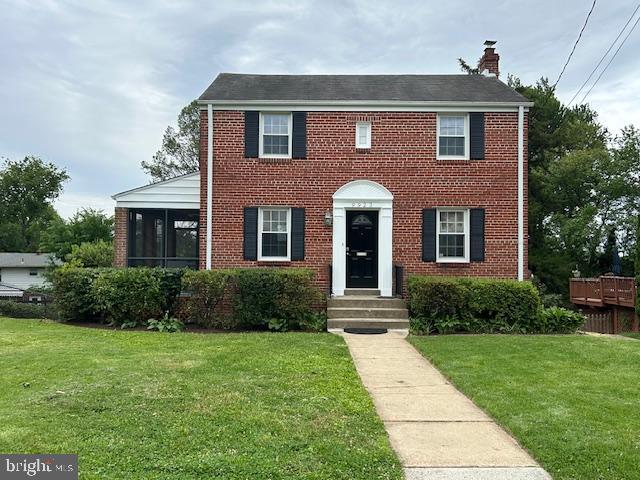9923 Grayson Avenue Silver Spring, MD 20901 - Photo 7 of 24 a front view of a house with garden