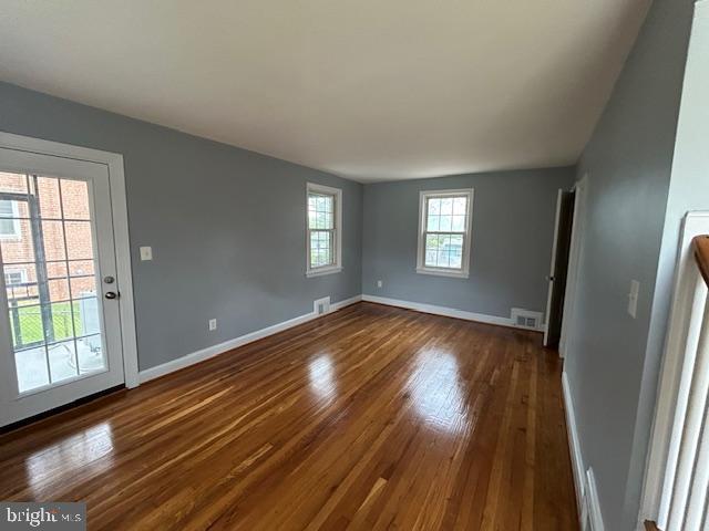 9923 Grayson Avenue Silver Spring, MD 20901 - Photo 10 of 24 a view of an empty room with wooden floor and a window