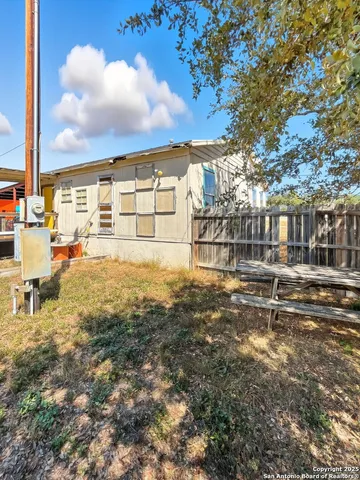 a kitchen with granite countertop a stove a sink and a microwave