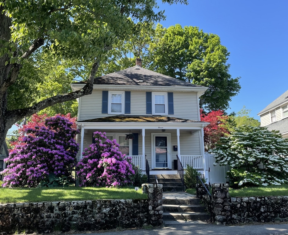 11 Sessions Street Wellesley, MA 02482 - Photo 1 of 22 a front view of a house with a garden