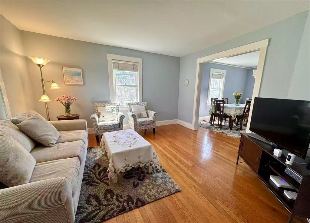 11 Sessions Street Wellesley, MA 02482 - Photo 4 of 22 a living room with furniture and a flat screen tv
