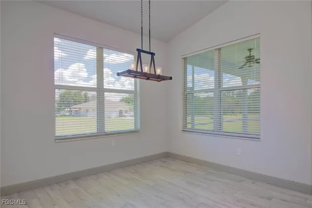 a room with a dresser and a window