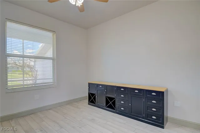 a view of an empty room and wooden floor