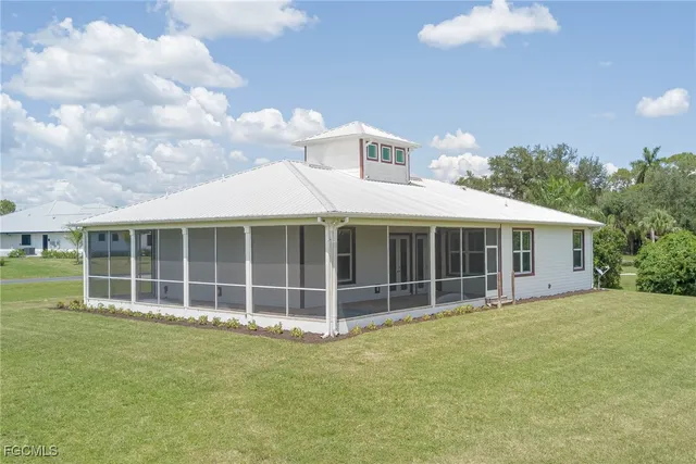 an aerial view of a houses with outdoor space