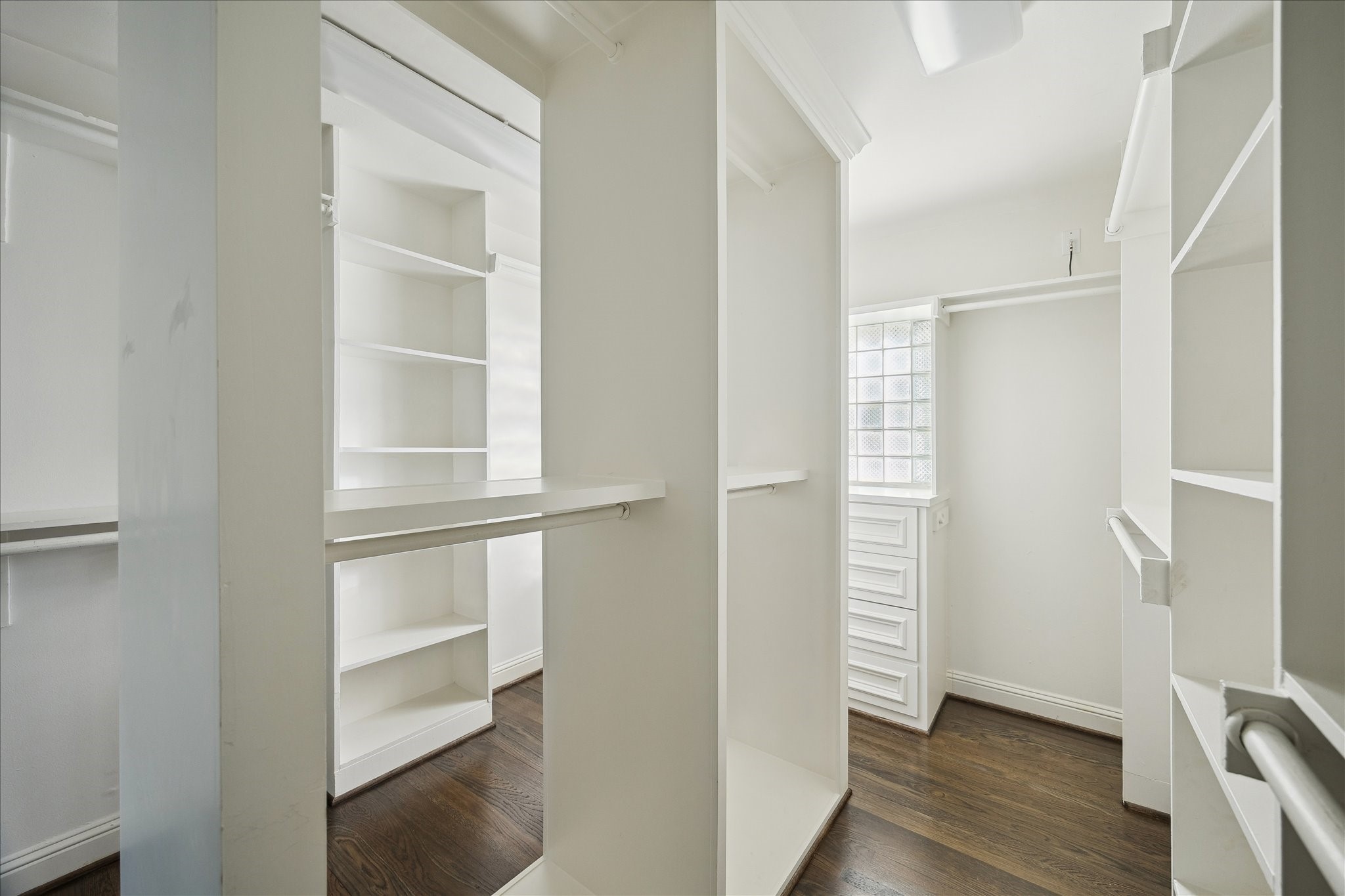 3049 Locke Lane Houston, TX 77019 - Photo 12 of 30 This walk-in primary closet is spacious and provides ample storage space.