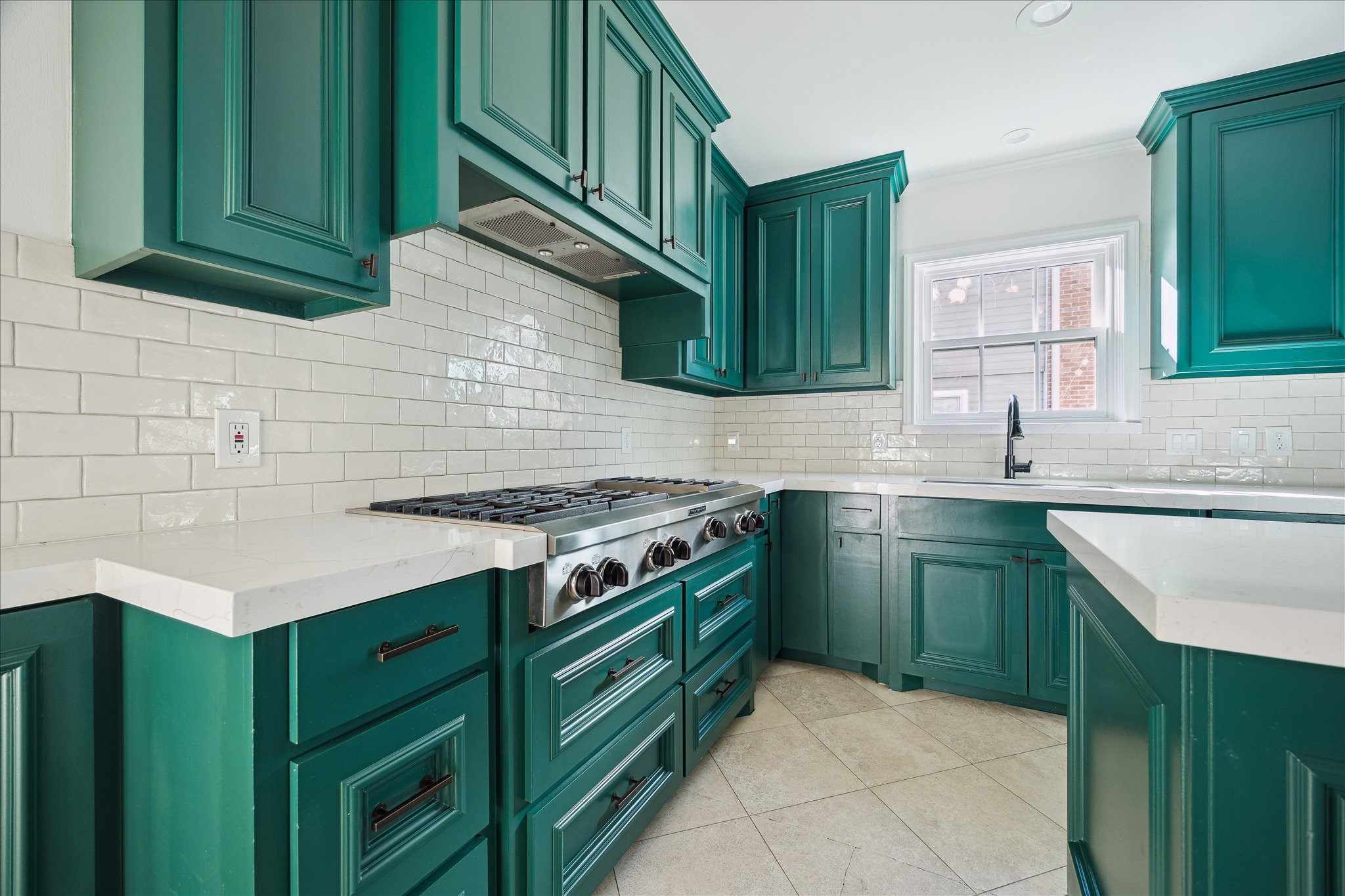 3049 Locke Lane Houston, TX 77019 - Photo 18 of 30 Fresh subway tile backsplash and crisp, white quartz counters make the space feel so incredibly bright.