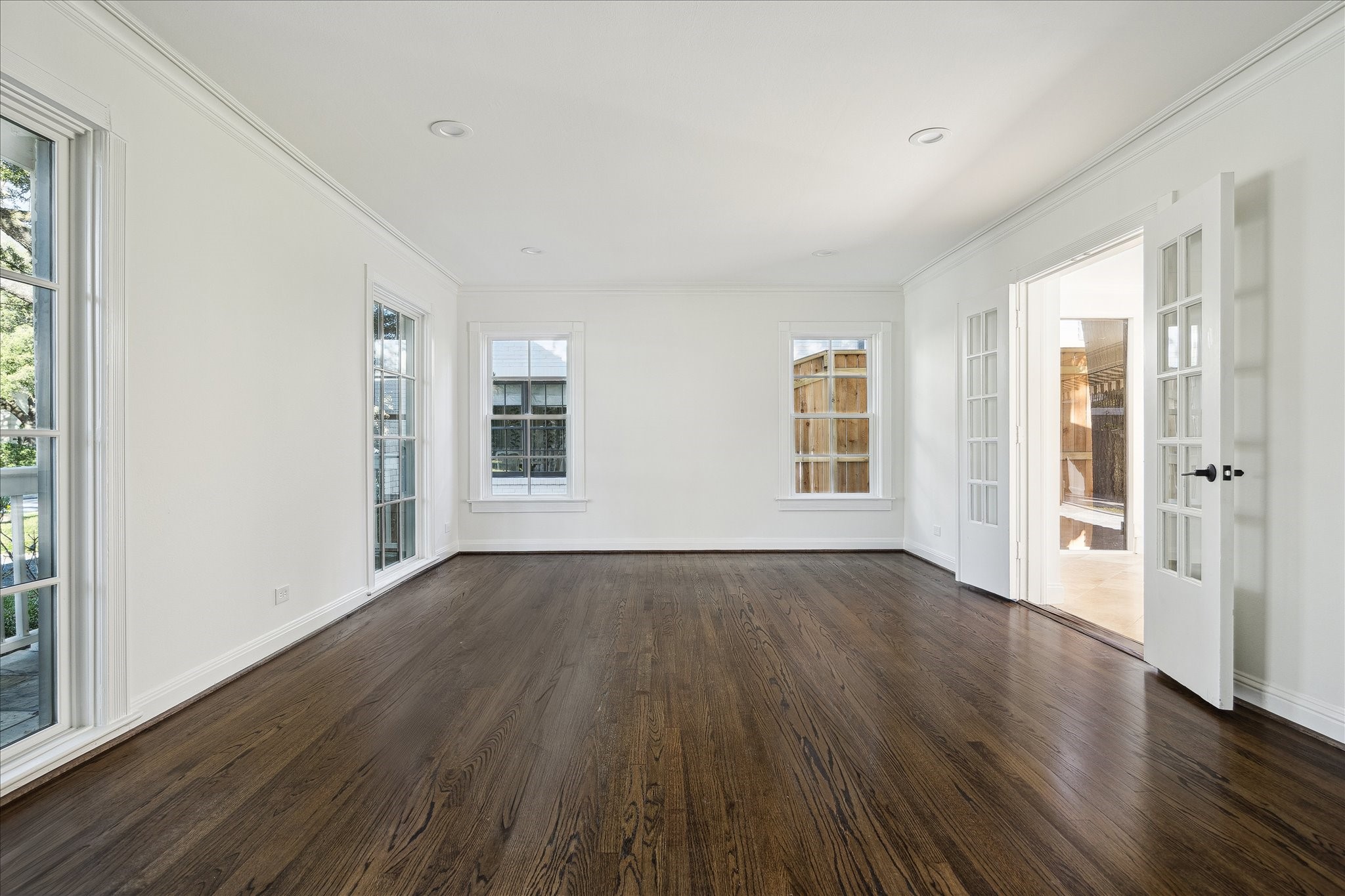 3049 Locke Lane Houston, TX 77019 - Photo 20 of 30 Oversized windows in the formal living expose the wonderful street and stunning porch in the front yard. Ample natural light streams from all angles and fills the room with light.