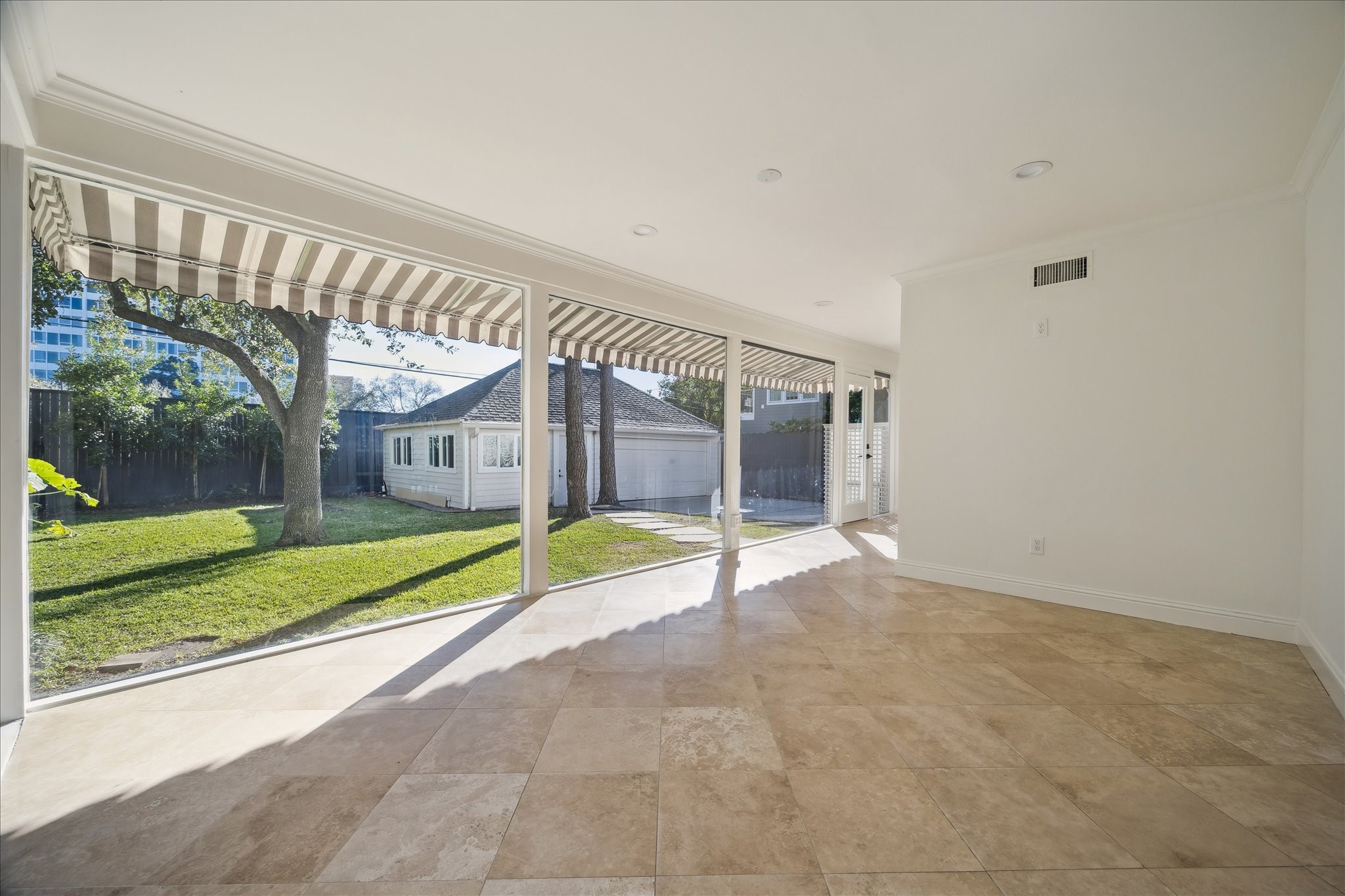 3049 Locke Lane Houston, TX 77019 - Photo 21 of 30 From this view of the family room, you can see how seamlessly the space flows to the outdoors.