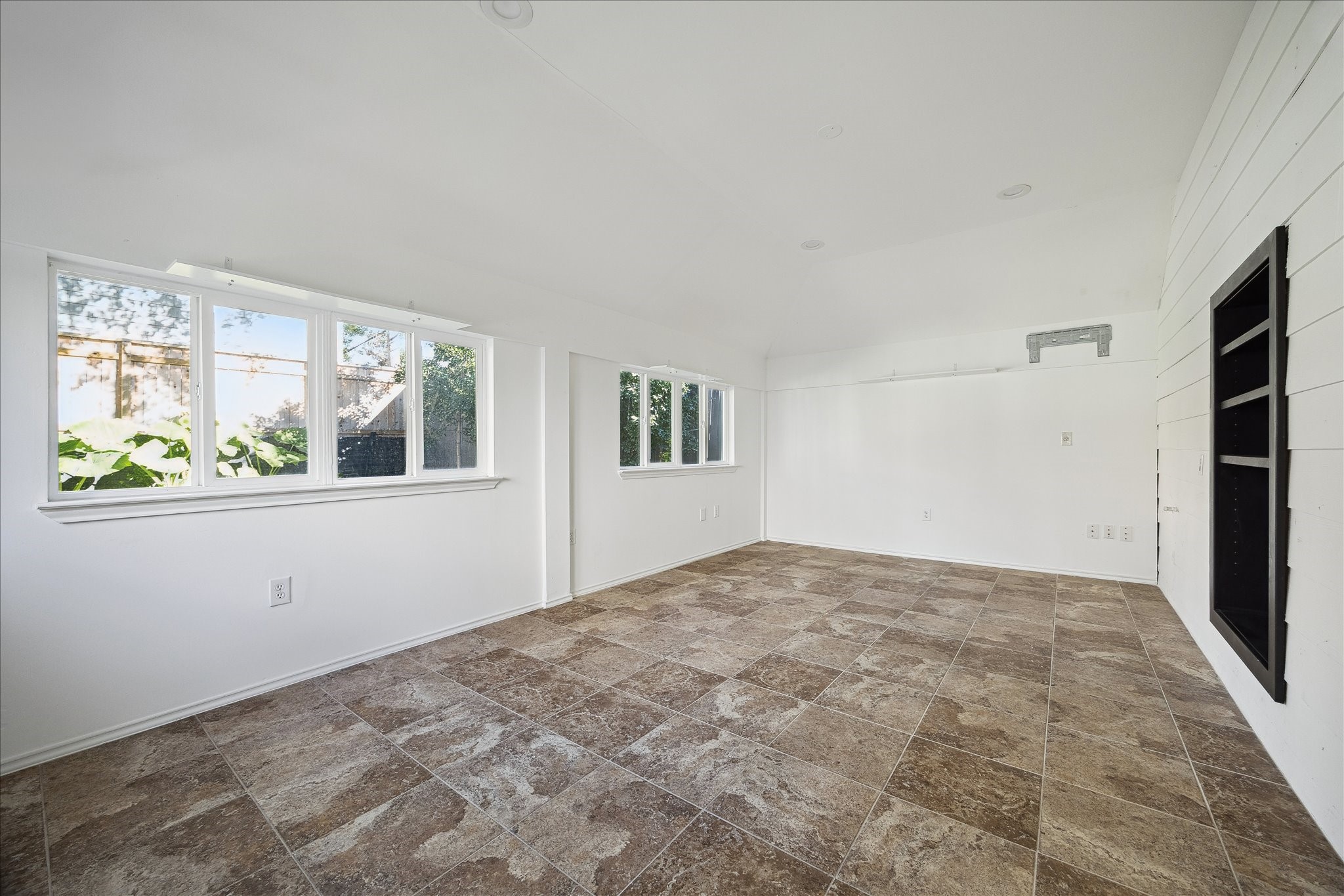 3049 Locke Lane Houston, TX 77019 - Photo 29 of 30 The flex space attached to the garage offers endless possibilities! The theme of the home is light and bright, with gorgeous windows throughout.