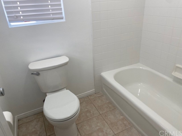 65 Ashford Irvine, CA 92618 - Photo 17 of 45 a white toilet sitting next to a bathtub
