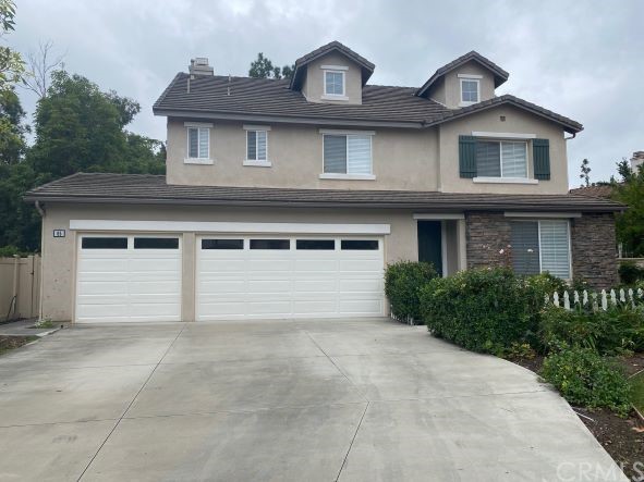 65 Ashford Irvine, CA 92618 - Photo 2 of 45 front view of a house with a yard