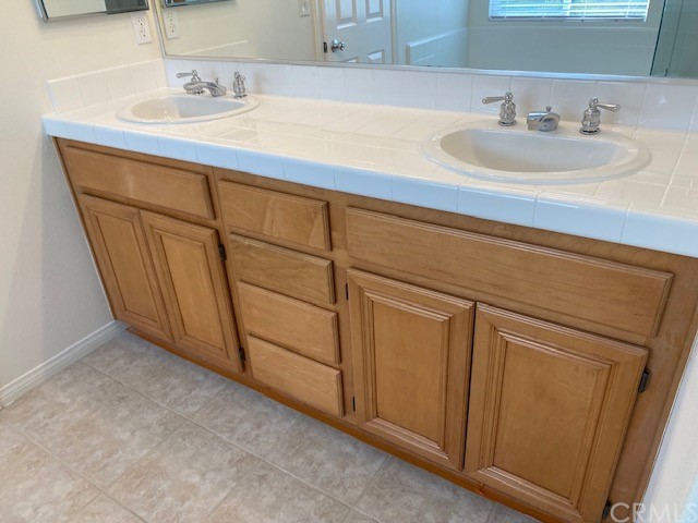 65 Ashford Irvine, CA 92618 - Photo 24 of 45 a bathroom with a sink and a mirror