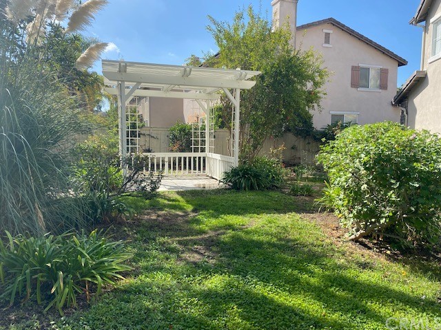 65 Ashford Irvine, CA 92618 - Photo 34 of 45 a view of a house with a yard