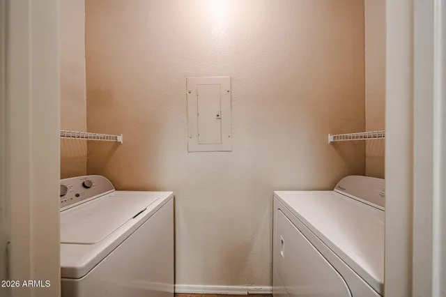 a bathroom with a double vanity sink mirror and toilet