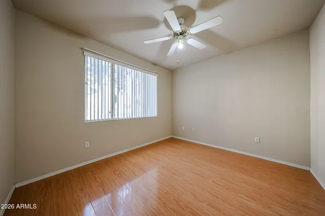 a view of hallway with wooden floor