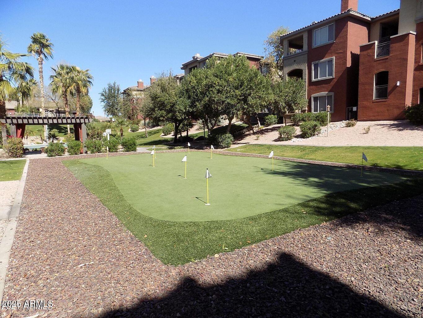 5401 East Van Buren Street, Unit 1027 Phoenix, AZ 85008 - Photo 20 of 23 a view of a house with a yard