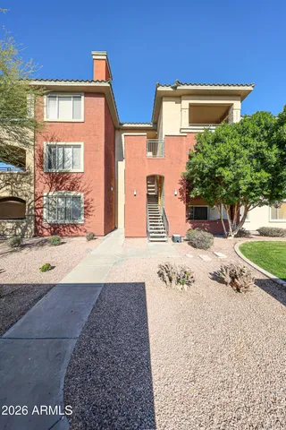 a view of a livingroom with a ceiling fan and wooden floor