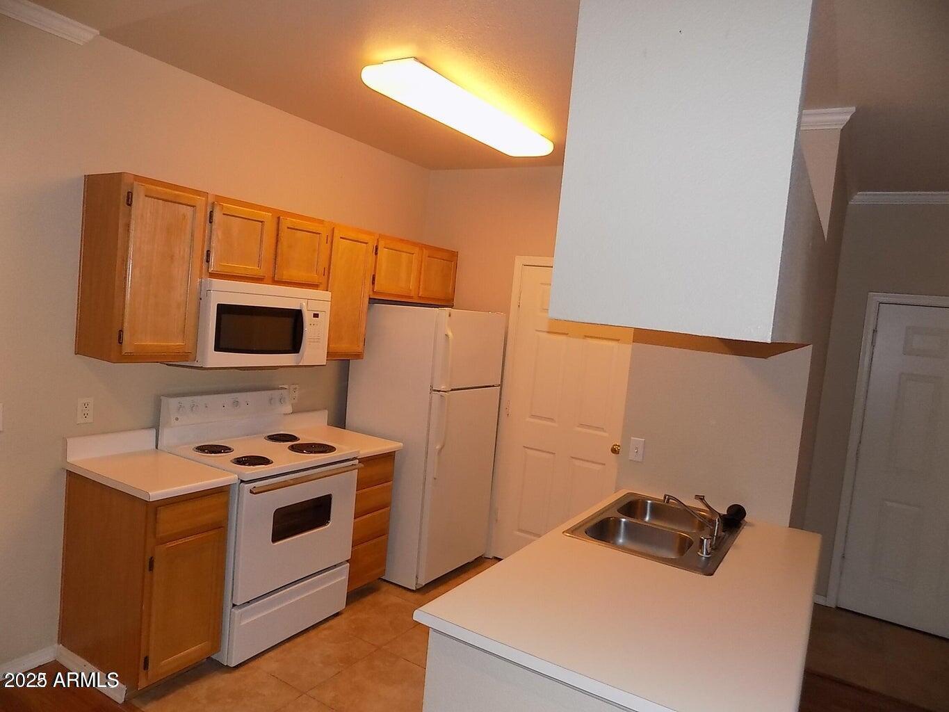 5401 East Van Buren Street, Unit 1027 Phoenix, AZ 85008 - Photo 5 of 23 a room with storage and utility