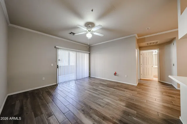 a kitchen with a wooden floor and a sink