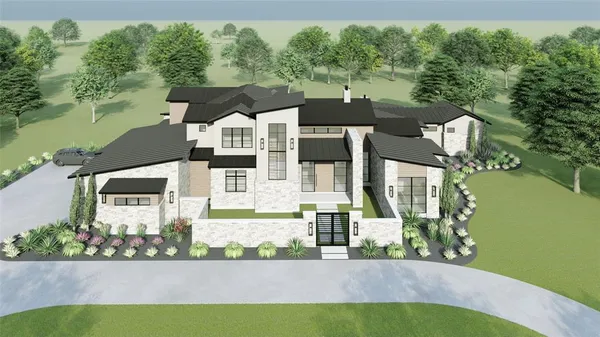 an aerial view of a house with outdoor space lake view and trees in the background