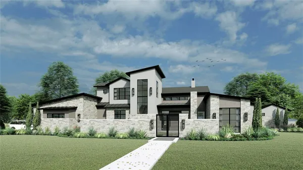 a front view of a house with a yard and trees
