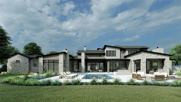 a front view of a house with a garden and plants