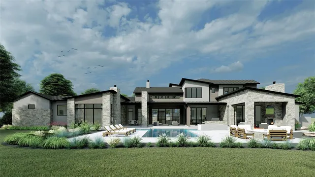 a front view of a house with a garden and plants