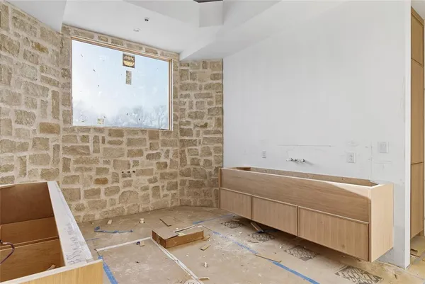 a bathroom with a tub sink and mirror