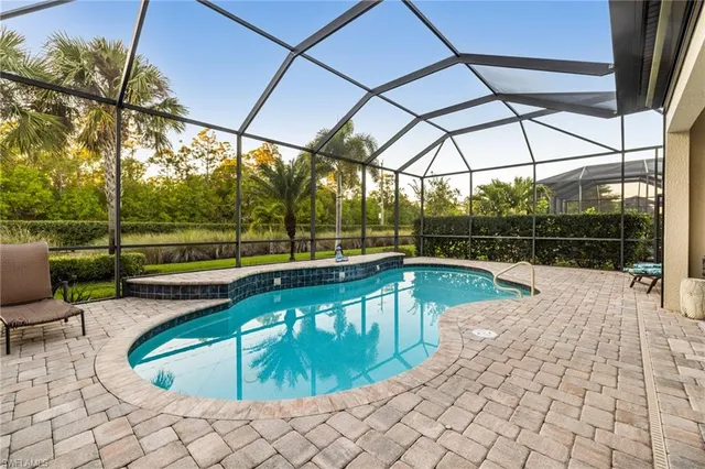 a view of a swimming pool with a patio