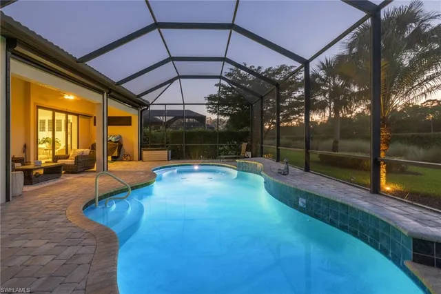 a view of swimming pool with a patio