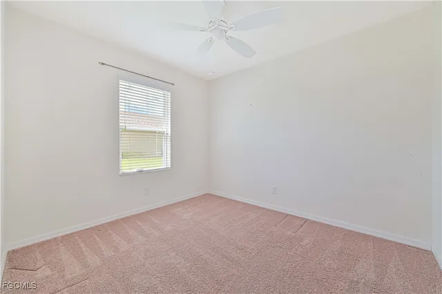 a bathroom with a granite countertop toilet a sink and a bathtub