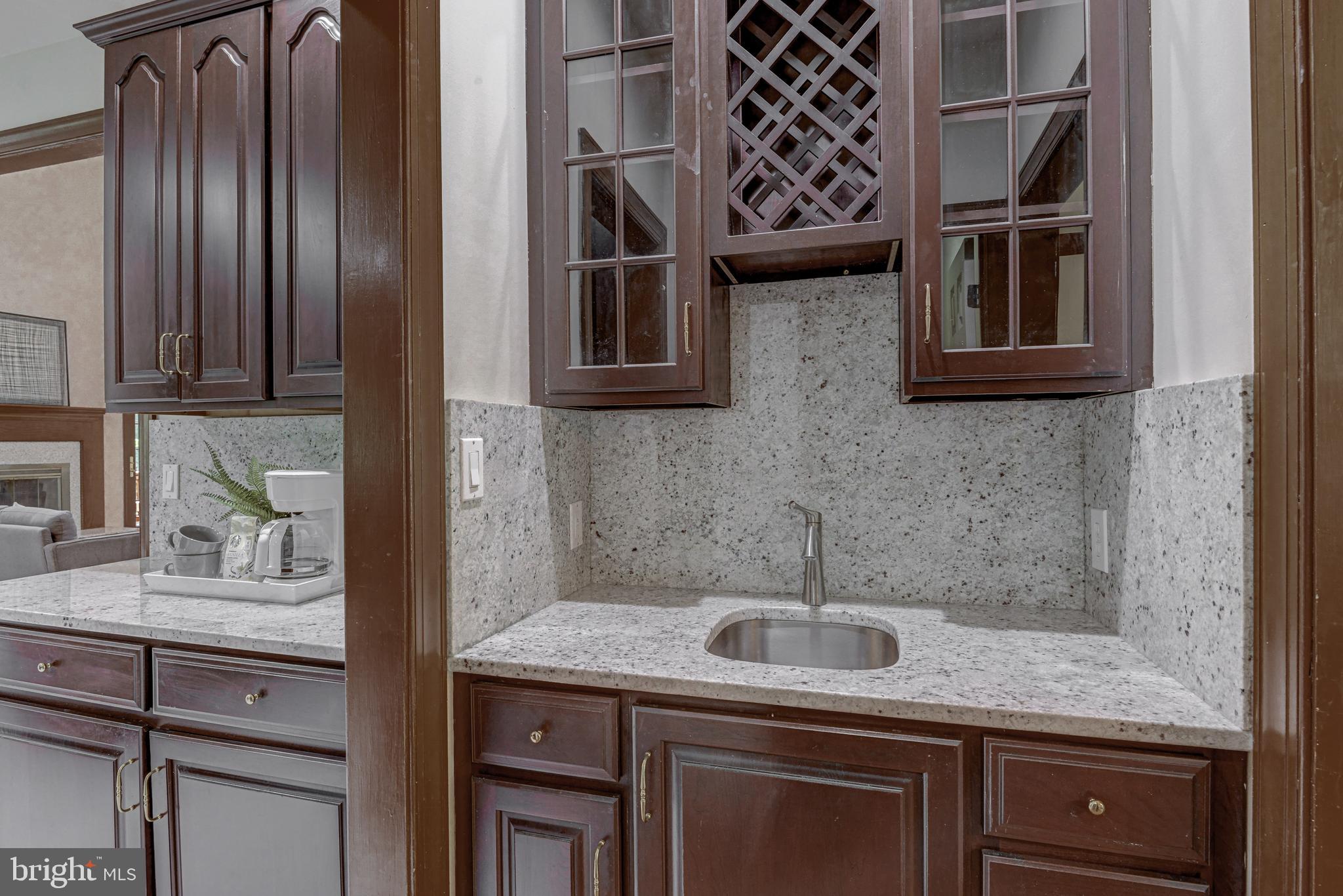 2172 Misty Meadow Road Finksburg, MD 21048 - Photo 45 of 118 Butler's pantry with sink and wine storage.