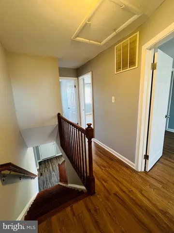a view of a porch with wooden floor