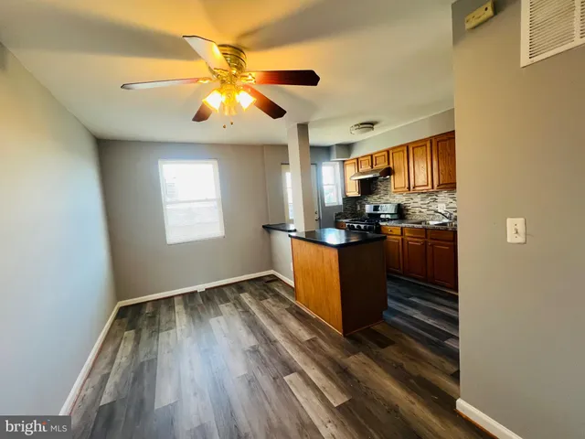 a view of kitchen with window and stainless steel appliances