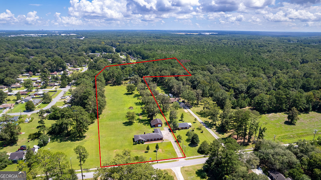 1324 South Rogers Street Pooler, GA 31322 - Photo 3 of 10 a view of a lake with a city view