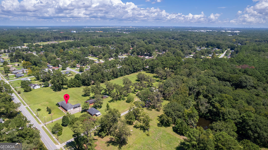 1324 South Rogers Street Pooler, GA 31322 - Photo 10 of 10 an aerial view of residential houses with outdoor space and mountain view