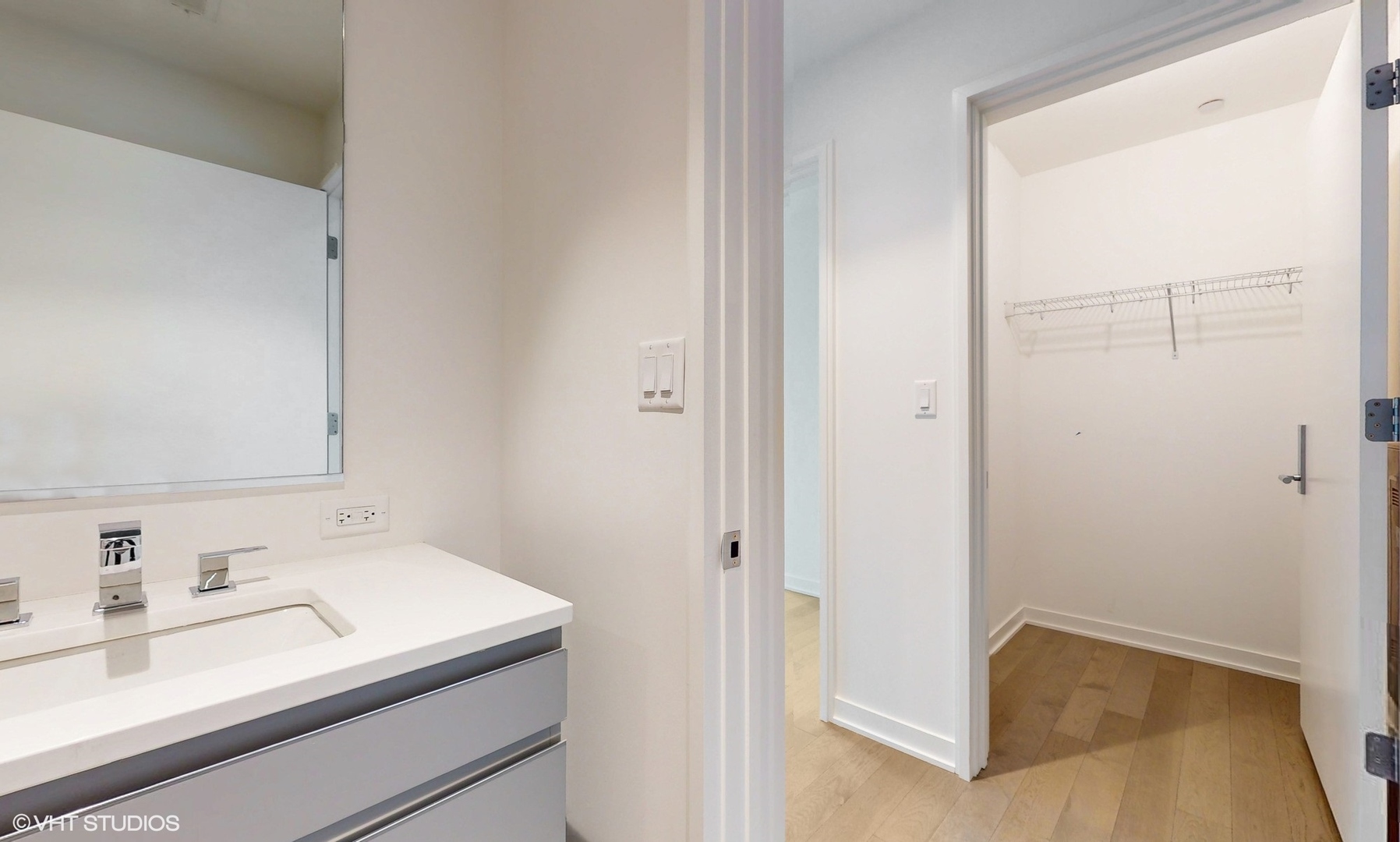 1400 West Monroe Street, Unit 5E Chicago, IL 60607 - Photo 22 of 28 a bathroom with a sink and a mirror