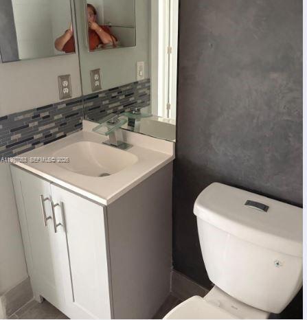 13447 Southwest 154th Street, Unit 2208 Miami, FL 33177 - Photo 8 of 11 a bathroom with a sink and a toilet