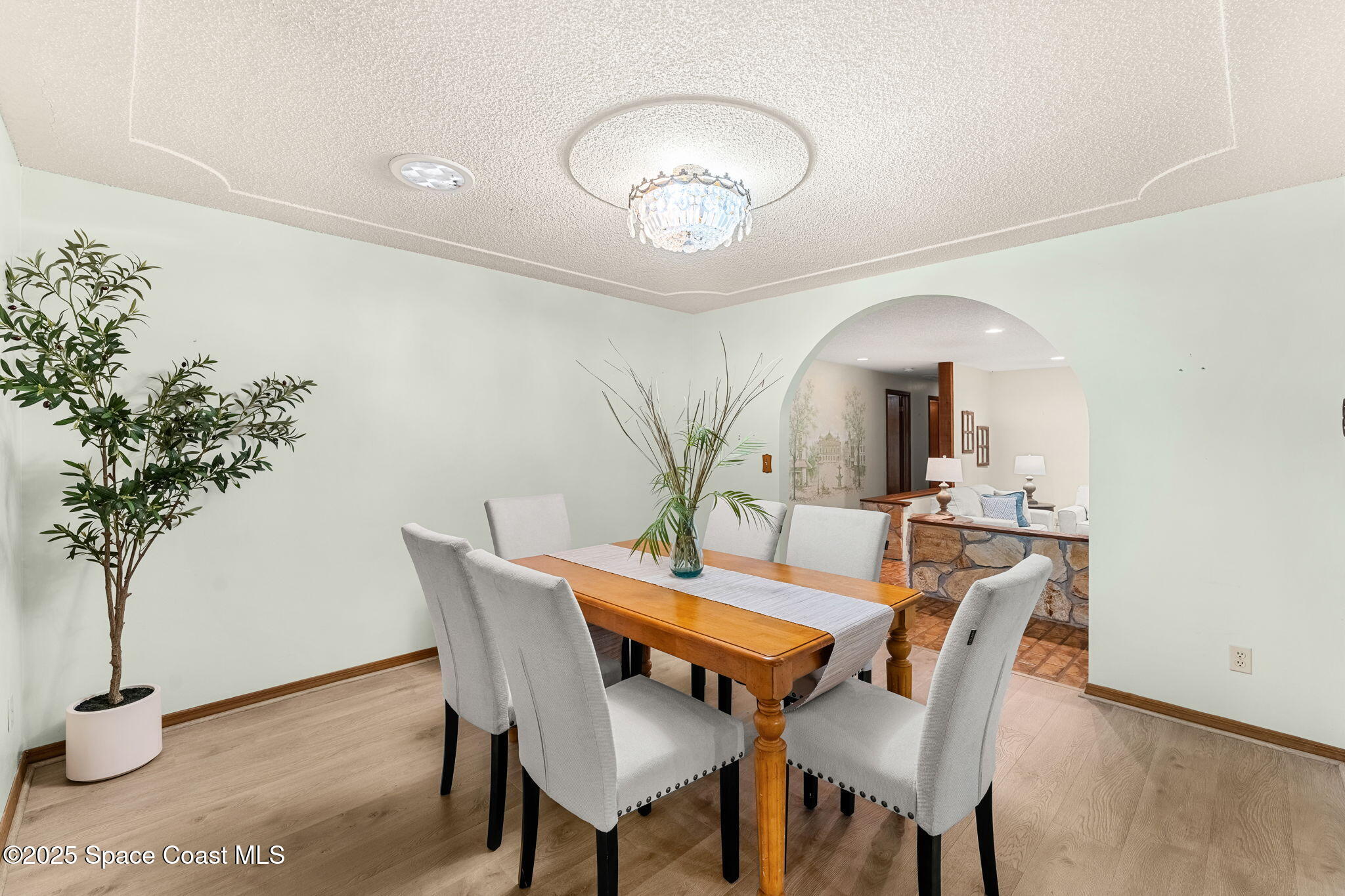 4 Colonial Way Indian Harbour Beach, FL 32937 - Photo 17 of 58 a view of a dining room with furniture and wooden floor