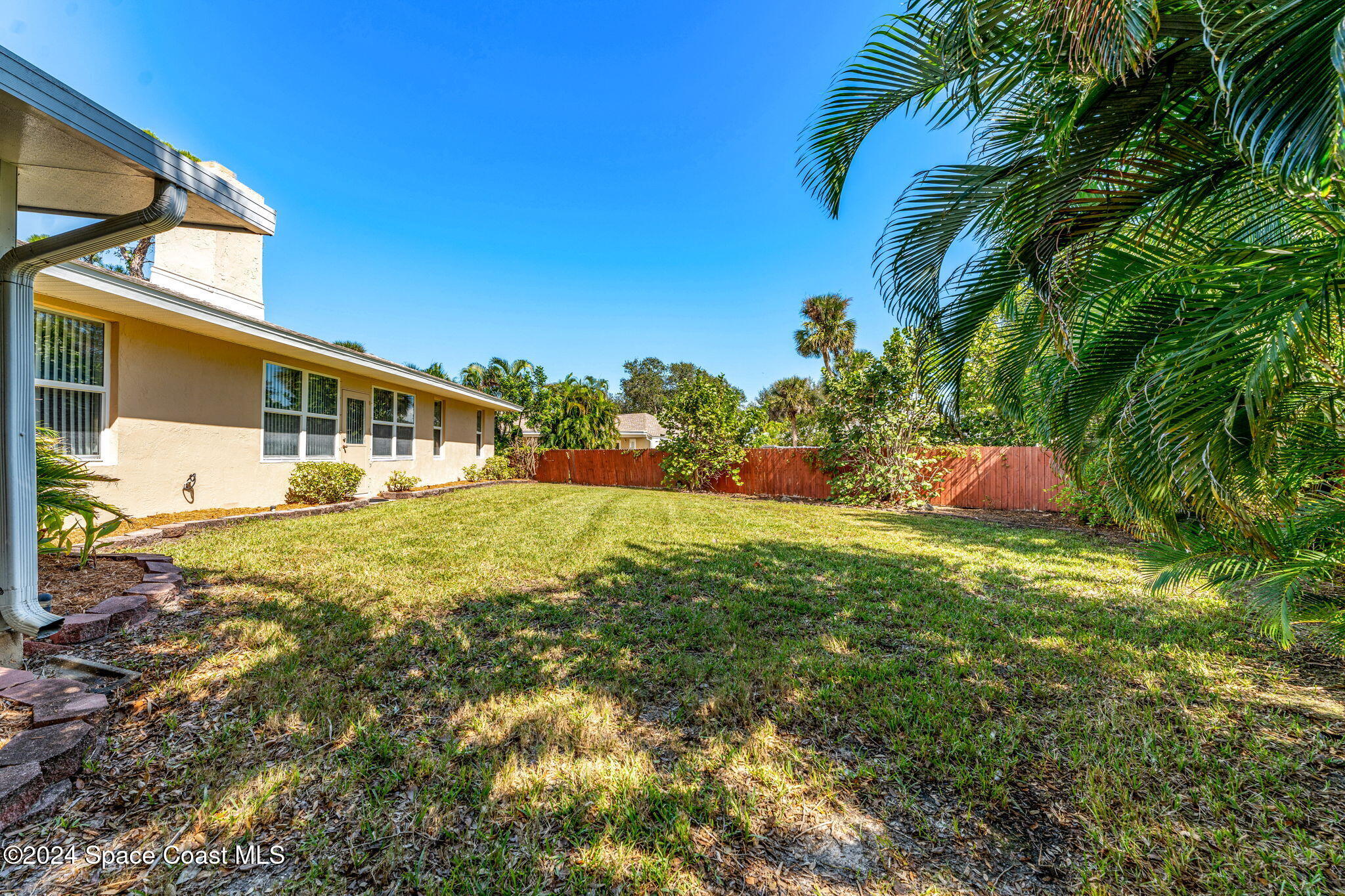 4 Colonial Way Indian Harbour Beach, FL 32937 - Photo 38 of 58 a front view of a house with a yard