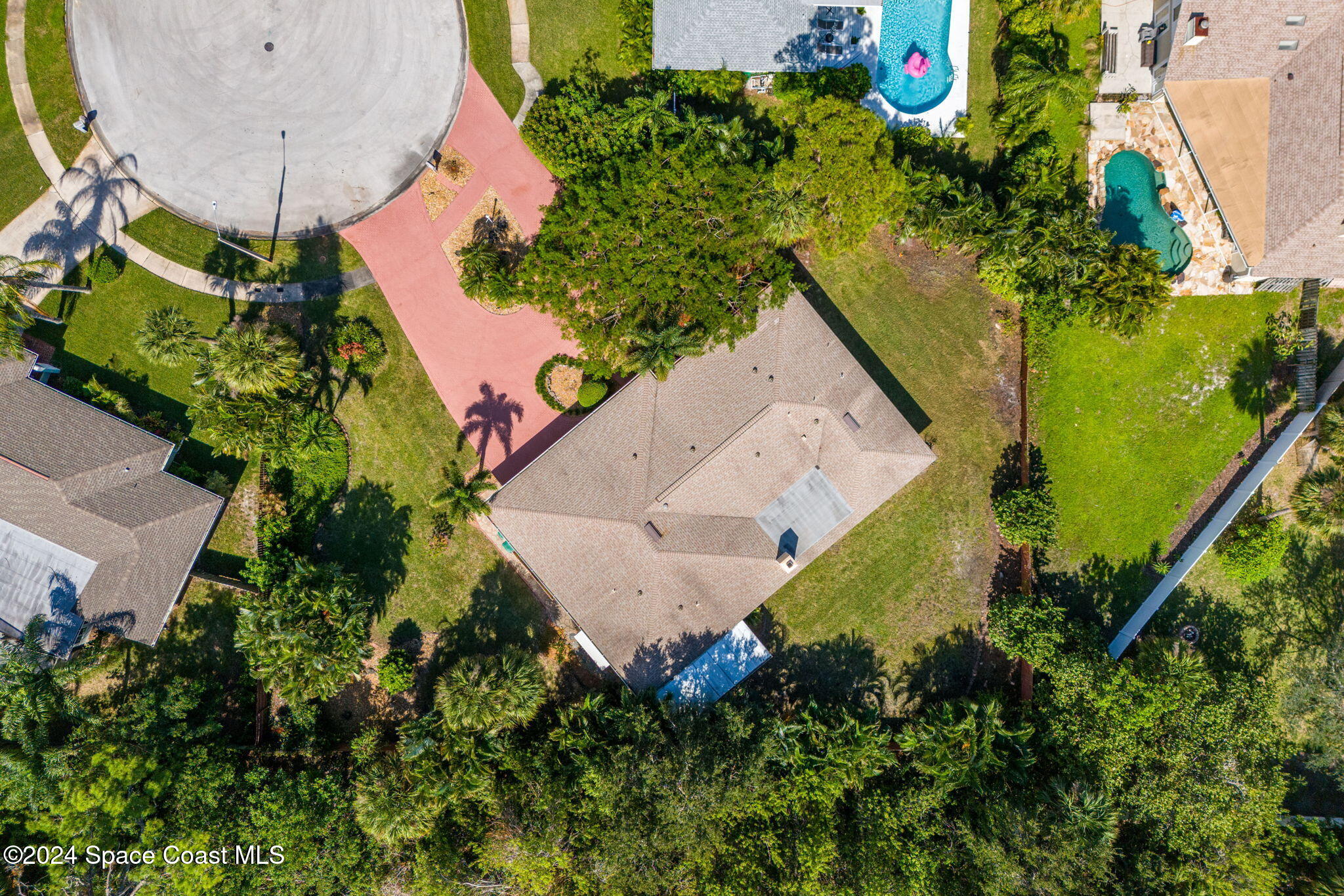 4 Colonial Way Indian Harbour Beach, FL 32937 - Photo 41 of 58 an aerial view of a house with a yard and a wooden fence