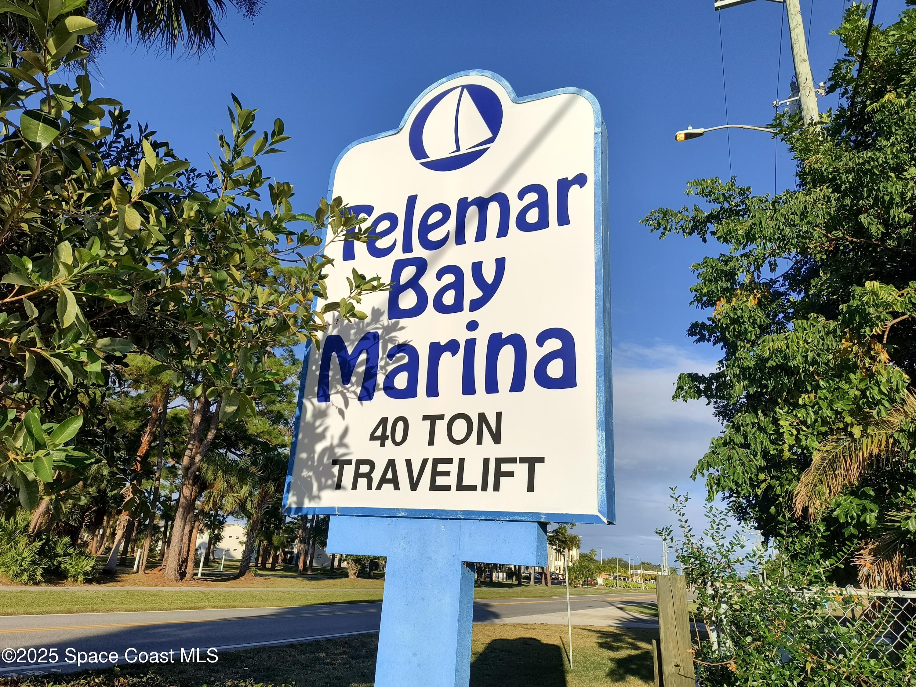 4 Colonial Way Indian Harbour Beach, FL 32937 - Photo 47 of 58 a sign that is on a pole