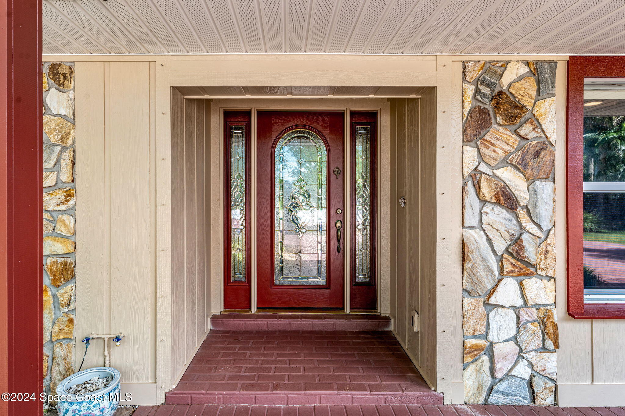 4 Colonial Way Indian Harbour Beach, FL 32937 - Photo 9 of 58 a view of front door with wooden floor